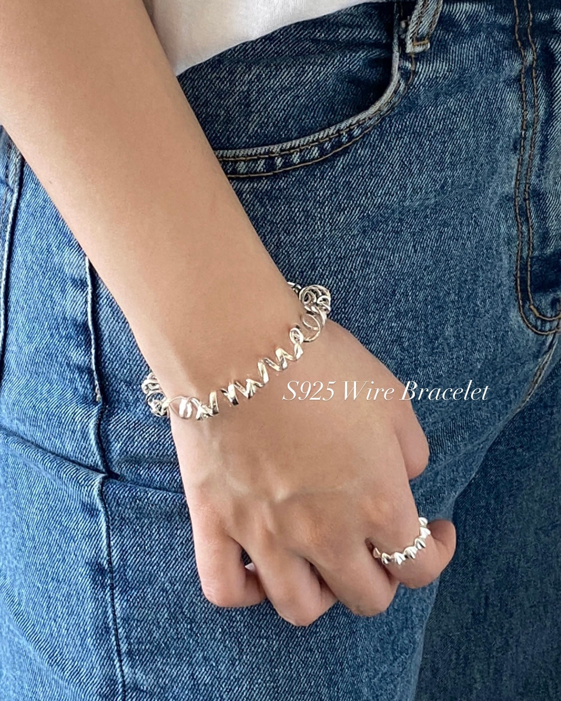 Detail of secure box clasp on a silver twisted wire bracele