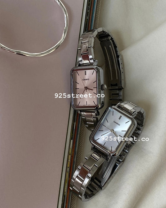 High-resolution front view showcasing the pink and blue square dial.